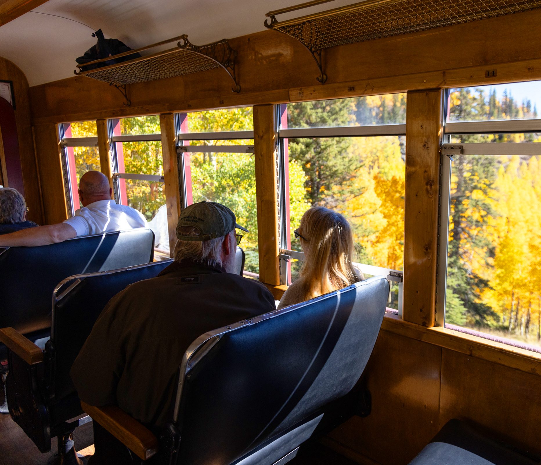 a group of people sitting in a chair in front of a window