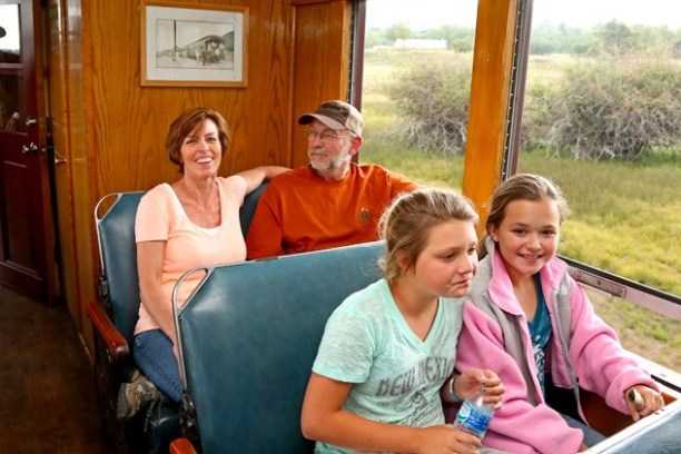 a group of people sitting posing for the camera