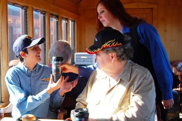a man and woman preparing food in a restaurant