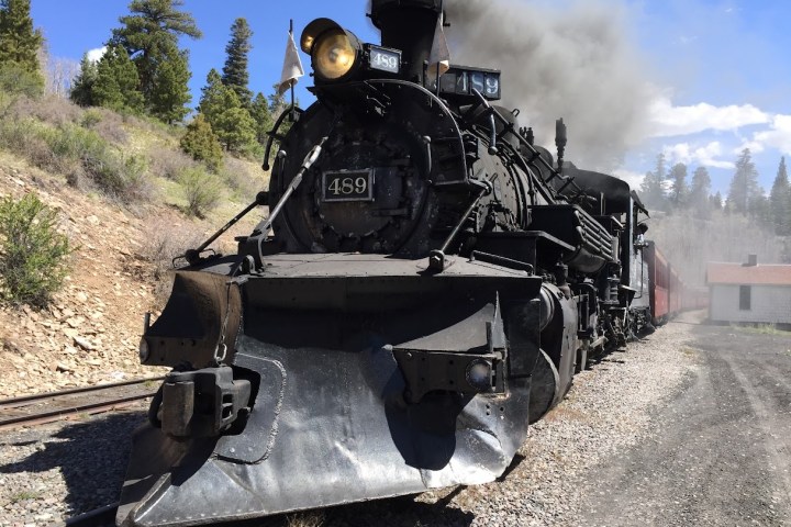 a steam engine on a dirt track