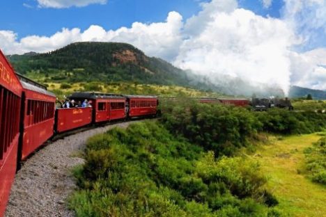 a train is coming down the mountain