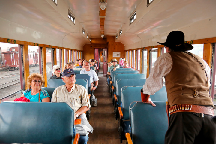 a group of people sitting at a train station