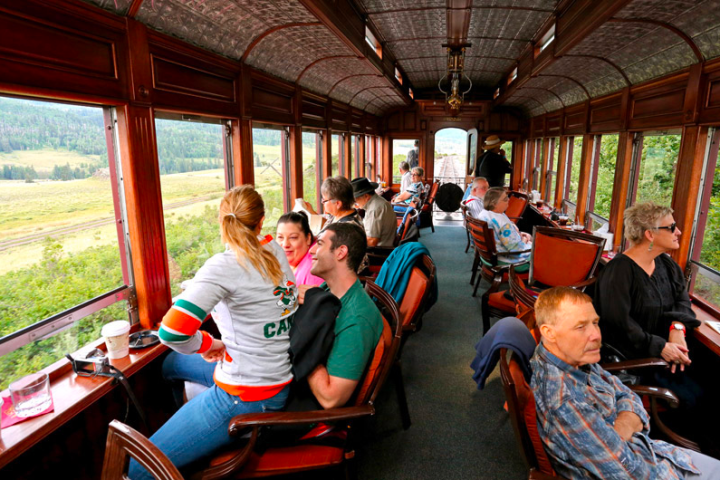 a group of people sitting at a train station
