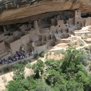 a group of cliff with Mesa Verde National Park in the background