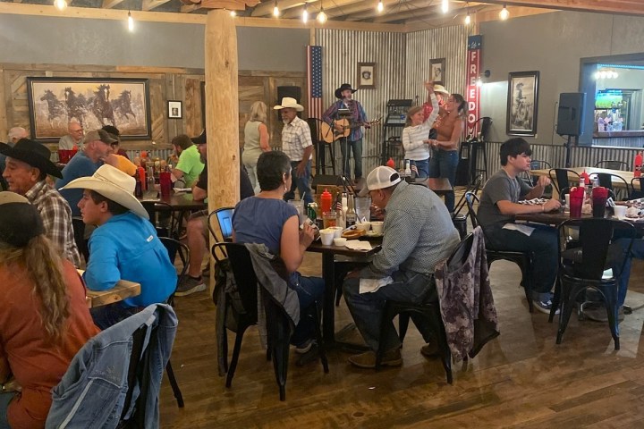 a group of people standing in a room