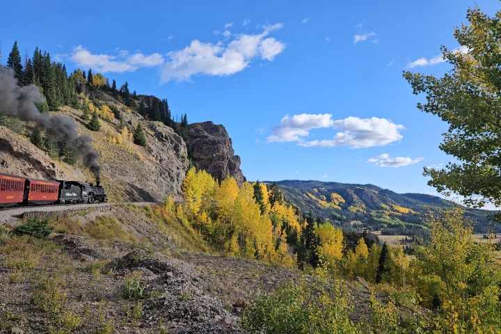 a train is on the side of a mountain