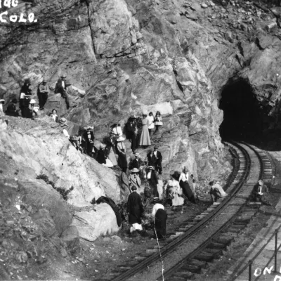 a group of people on a rock