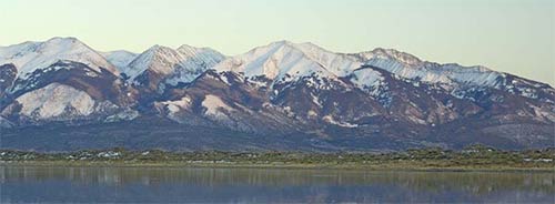 a lake with a mountain in the background