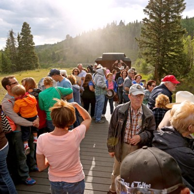 a group of people standing in front of a crowd
