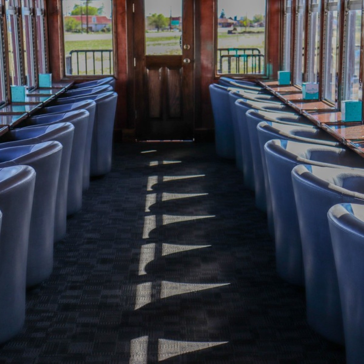 a row of wooden benches sitting on top of a chair