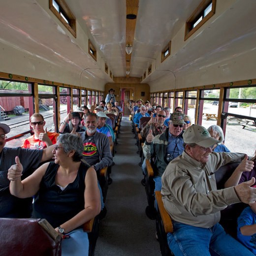 a group of people sitting at a train station