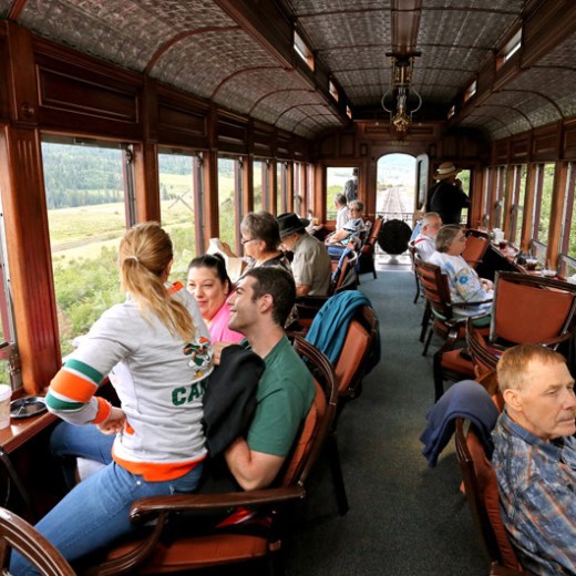 a group of people sitting at a table in front of a window