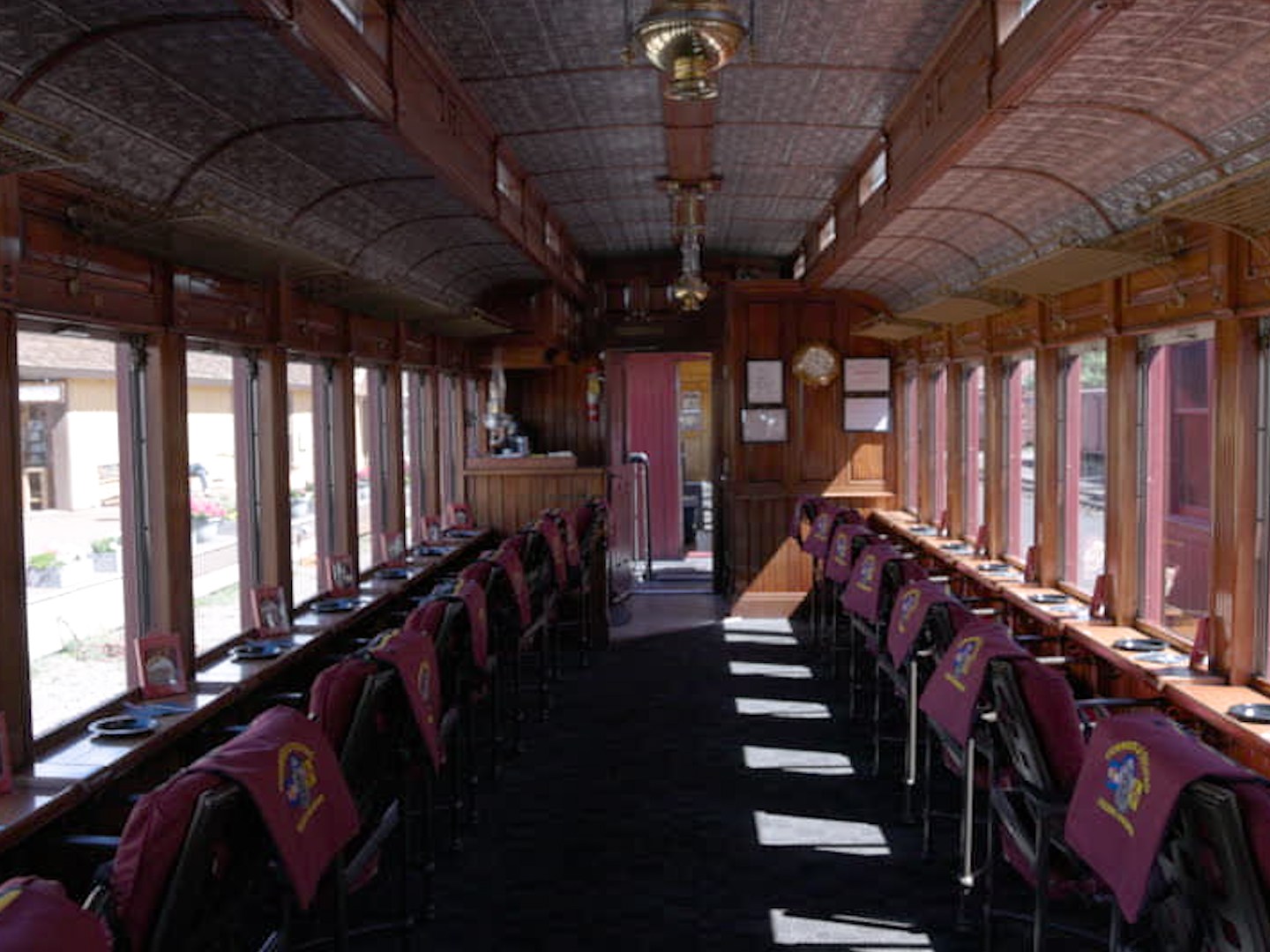 Parlor car offers plush padded chairs and large windows