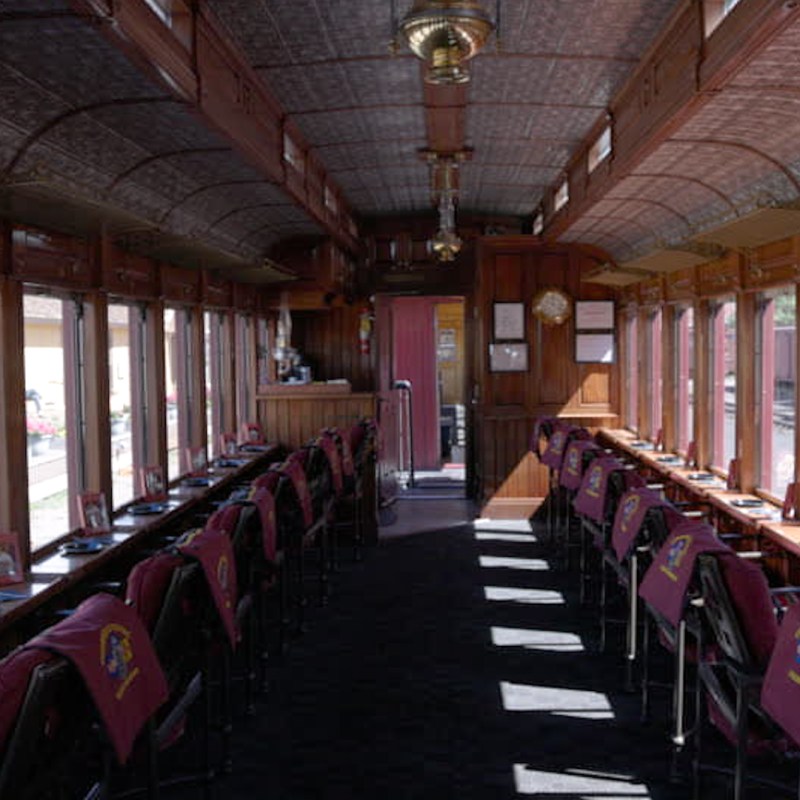 Parlor car offers plush padded chairs and large windows
